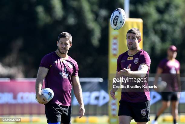 Ben Hunt and Andrew McCullough chat during a Queensland Maroons training session at Sanctuary Cove on May 31, 2018 at the Gold Coast, Australia.