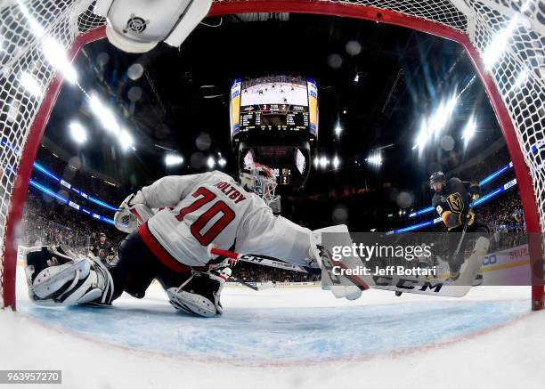 Braden Holtby of the Washington Capitals makes a diving stick-save on Alex Tuch of the Vegas Golden Knights during the third period in Game Two of...