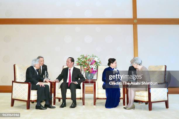 Vietnamese President Tran Dai Quang and his wife Nguyen Thi Hien talk with Emperor Akihito and Empress Michiko during their meeting at the Imperial...