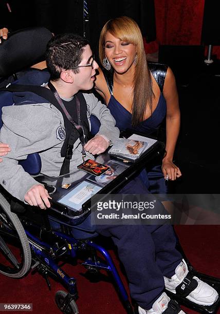 Grammy winning recording artist Beyonce greets a fan during the launch of her new fragrance "Heat" at Macy's Herald Square on February 3, 2010 in New...