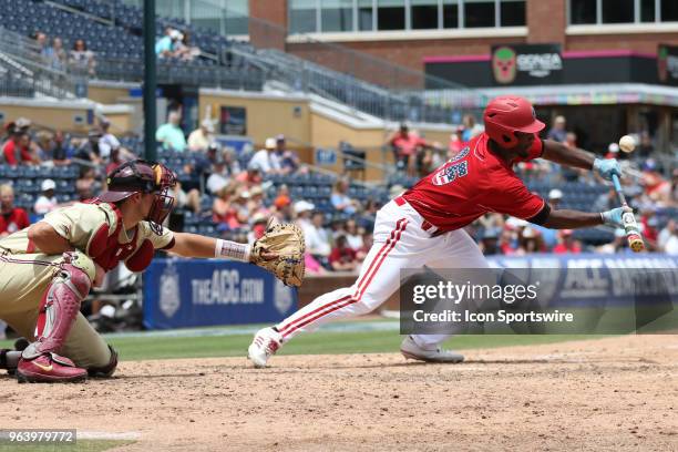 Louisville outfielder Josh Stowers bunts the ball during the ACC Baseball Championship game between the Florida State and the Louisville Cardinals on...