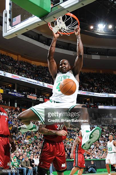 Kendrick Perkins of the Boston Celtics dunks the ball during the game against the Miami Heat on February 3, 2010 at the TD Garden in Boston,...