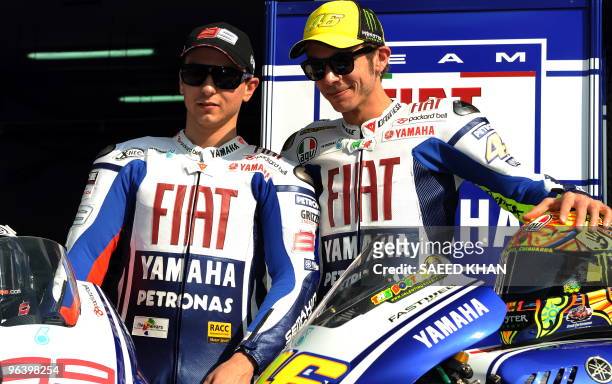 Fiat Yamaha team members Valentino Rossi of Italy and Jorge Lorenzo of Spain pose for pictures at a ceremony on Sepang circuit near Kuala Lumpur on...