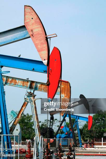 Oil pumps operate in the U-Thong petroleum field at PTT Exploration & Production Pcl's PTTEP 1 Project site in Amphur Muang, Suphanburi province,...