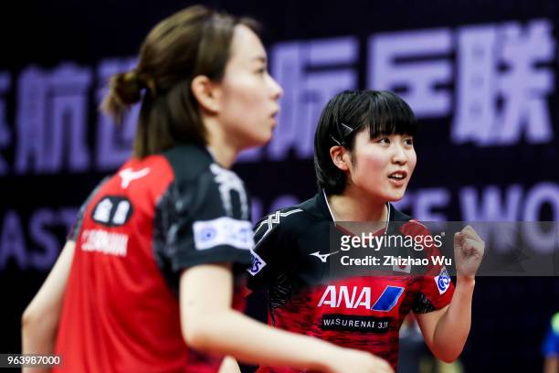 Hirano Miu and Ishikawa Kasumi of Japan celebrate a point at the women's doubles match compete with Zeng jian and Zhou Yihan of Singapore during the...