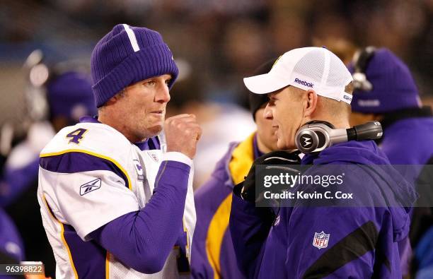 Quarterback Brett Favre of the Minnesota Vikings and an assistant coach against the Carolina Panthers at Bank of America Stadium on December 20, 2009...