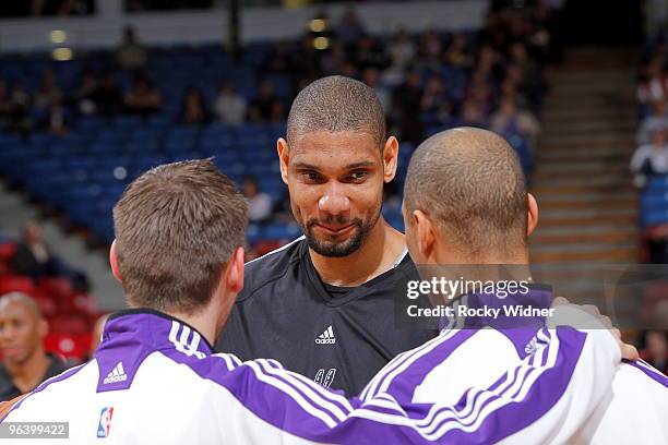 Tim Duncan of the San Antonio Spurs talks with former teammates Beno Udrih and Ime Udoka of the Sacramento Kings before the game on February 3, 2010...