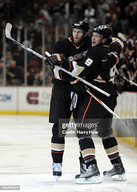 Ryan Whitney of the Anaheim Ducks celebrates his goal with Bobby Ryan for a 1-0 lead against the Detroit Red Wings during the first period at the...