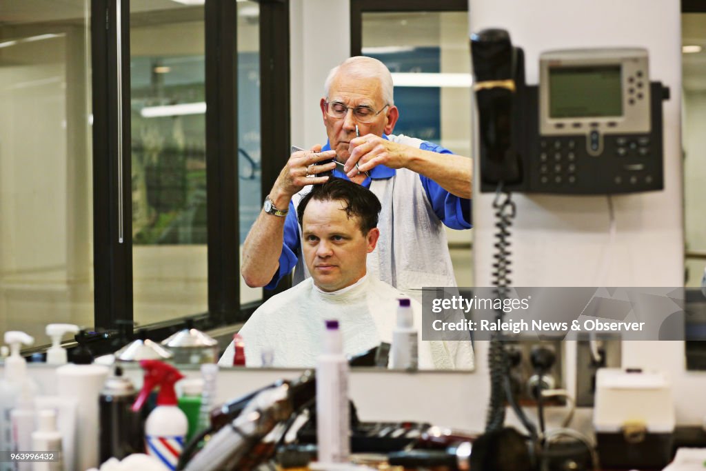 This barber outlasted the flattop and the mullet. At 85, his clippers are still buzzing