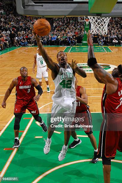 Tony Allen of the Boston Celtics lays the ball up in the lane against Jermaine O' Neal of the Miami Heat on February 3, 2010 at the TD Garden in...