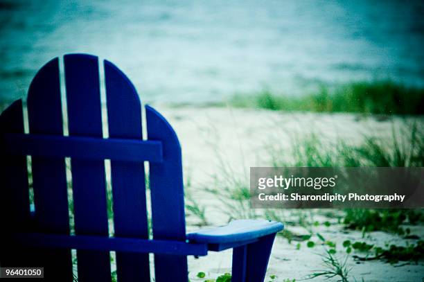 blue adirondack chair at the beach - adirondack chair closeup stock pictures, royalty-free photos & images