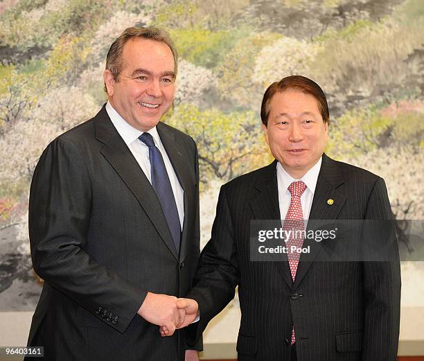 Assistant Secretary of State Kurt Campbell shake hands with South Korean Foreign Minister Yu Myung-Hwan during their meeting at the foreign ministry...