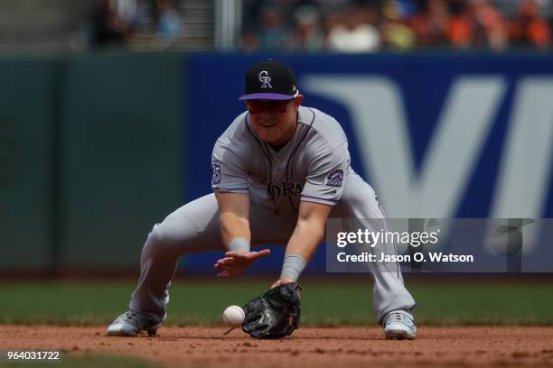Pat Valaika of the Colorado Rockies fields a ground ball against the San Francisco Giants during the fourth inning at AT&T Park on May 20, 2018 in...