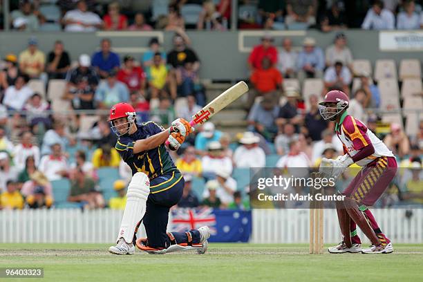 Tom Cooper of Australia bats during his century against the West Indies during the one day tour match between the Prime Minister's XI and the West...