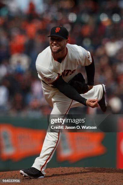 Hunter Strickland of the San Francisco Giants pitches against the Colorado Rockies during the ninth inning at AT&T Park on May 20, 2018 in San...