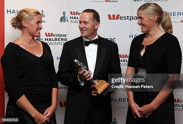 New Zealand rowing champions Georgina Earle and Caroline Meyer talk with New Zealand Prime Minister John Key after winning the Winner of the Decade...