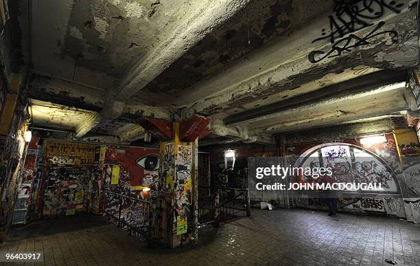 Worker sweeps the lobby of the Kunsthaus Tacheles artists' colony in Berlin's Mitte district January 29, 2010. The building known as the Tacheles was...