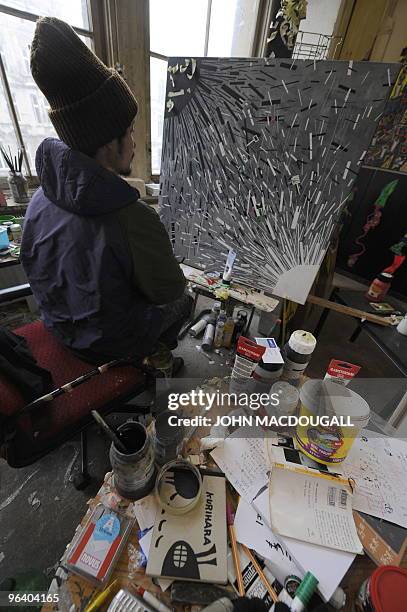 Japanese artist Takuya Kurihara at work in his atelier in the Kunsthaus Tacheles artists' colony in Berlin's Mitte district January 29, 2010. The...