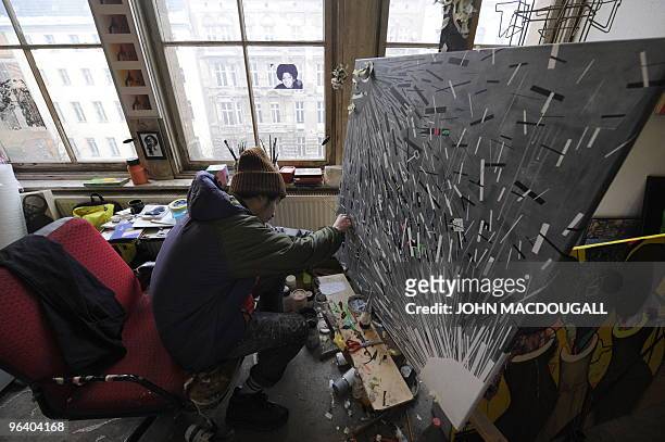 Japanese artist Takuya Kurihara at work in his atelier in the Kunsthaus Tacheles artists' colony in Berlin's Mitte district January 29, 2010. The...