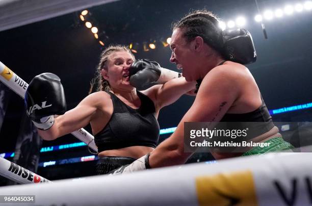 Ariane Goyette of Canada punches Christina Barry of Canada during their women's Super Lightweight fight at the Videotron Center on May 26, 2018 in...