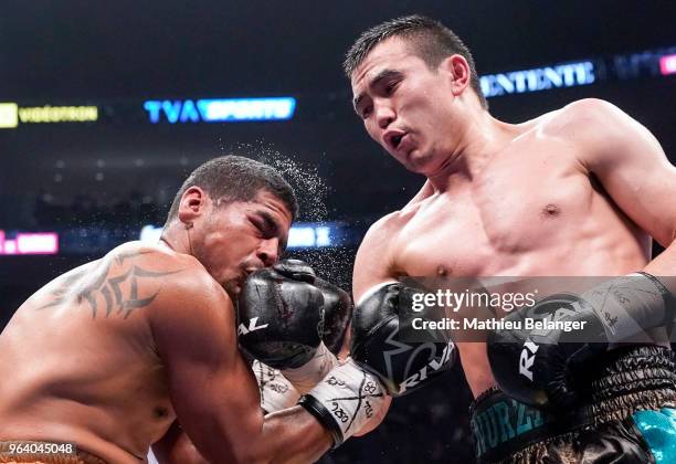 Nurzat Sabirov of Canada punches Rolando Paredes of Mexico during their Super Middleweight fight at the Videotron Center on May 26, 2018 in Quebec...