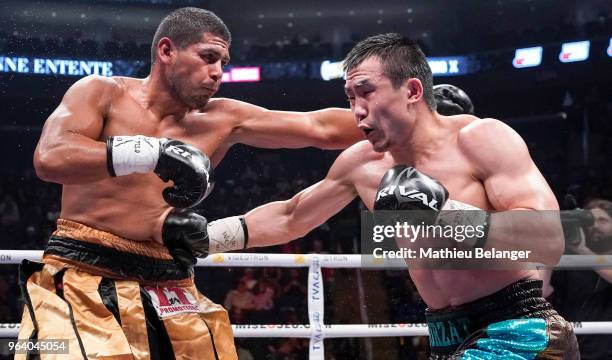 Nurzat Sabirov of Canada punches Rolando Paredes of Mexico during their Super Middleweight fight at the Videotron Center on May 26, 2018 in Quebec...
