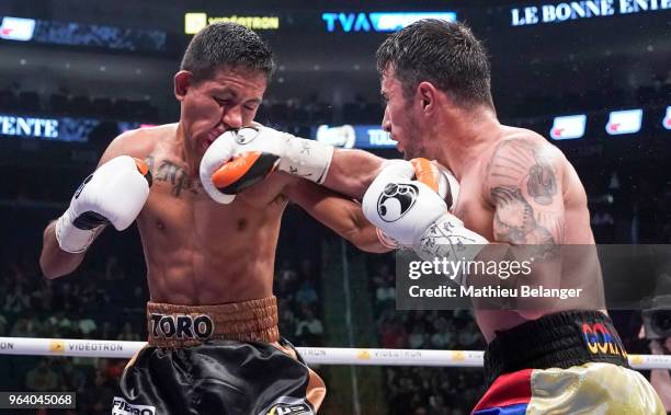 Andranik Grigoryan of Canada punches Jesus Amparan of Mexico during their Featherweight fight at the Videotron Center on May 26, 2018 in Quebec City,...