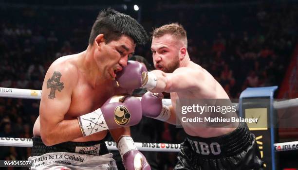 Vincent Thibault of Canada punches Carlos Jerez of Argentina during their Super Middleweight fight at the Videotron Center on May 26, 2018 in Quebec...