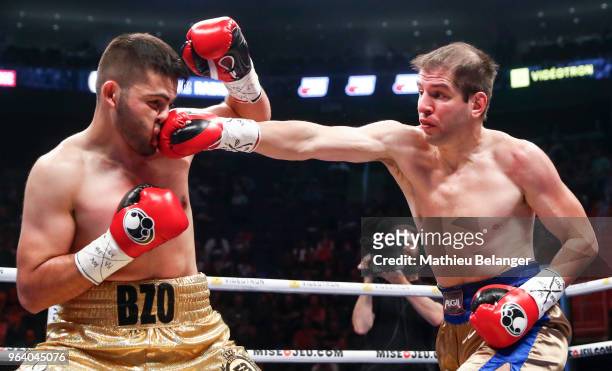 Alejandro Gustavo Falliga of Argentina punches Erik Bazinian of Canada during their Light Heavyweight fight at the Videotron Center on May 26, 2018...