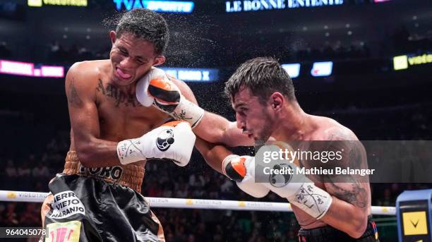 Andranik Grigoryan of Canada punches Jesus Amparan of Mexico during their Featherweight fight at the Videotron Center on May 26, 2018 in Quebec City,...