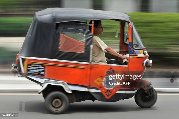 Photo taken in Jakarta on January 20, 2010 shows a Bajaj, a three-wheeled public transport. AFP PHOTO / Bay ISMOYO