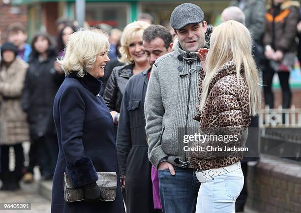 Camilla, Duchess of Cornwall chats to cast members Katherine Kelly and Simon Gregson during a tour of the Coronation Street set on February 4, 2010...