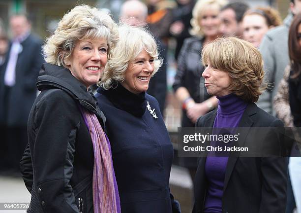 Camilla, Duchess of Cornwall smiles as she chats to cast members Helen Worth and Sue Nicholls during a tour of the Coronation Street set on February...