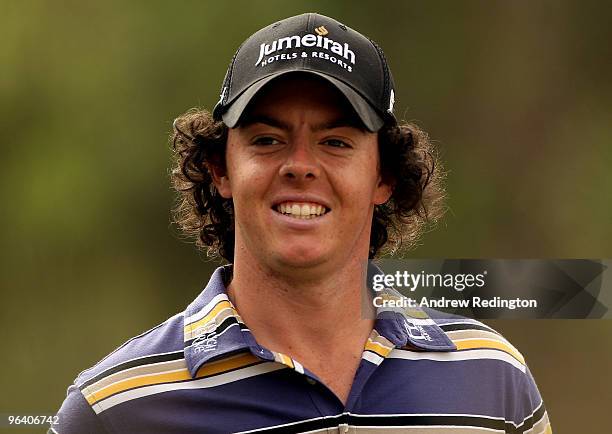 Rory McIlroy of Northern Ireland smiles on the 12th hole during the first round of the Omega Dubai Desert Classic on February 4, 2010 in Dubai,...