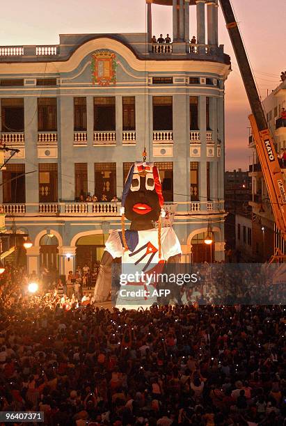 An 18-meter rag doll is held up by a crane in the central park of Camaguey, Cuba on February 3, 2010. The rag doll hopes to win the Guinness record....