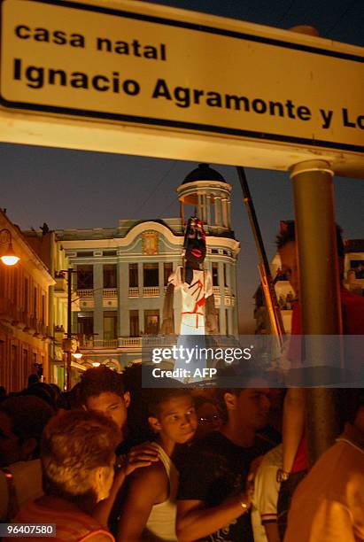 An 18-meter rag doll is held up by a crane in the central park of Camaguey, Cuba on February 3, 2010. The rag doll hopes to win the Guinness record....