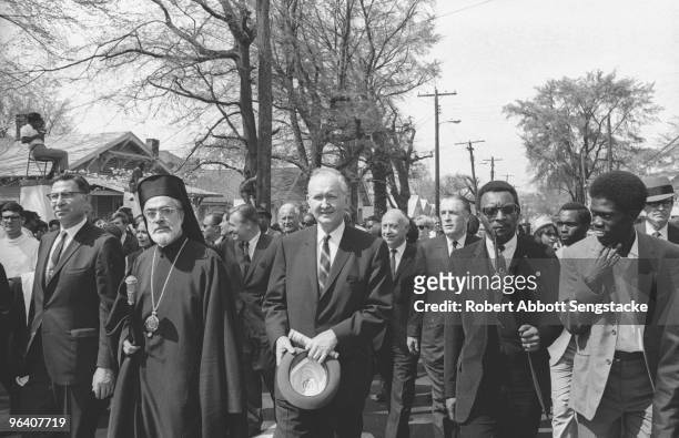 Close-up of mourners during a massive funeral procession for assassinated Civil Rights leader Dr. Martin Luther King Jr., through the streets of...