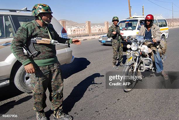 Yemeni soldiers stop a motorcycle at a checkpoint in Sanaa on February 4, 2010. Radical Yemeni cleric Anwar al-Awlaqi has praised a Christmas Day...