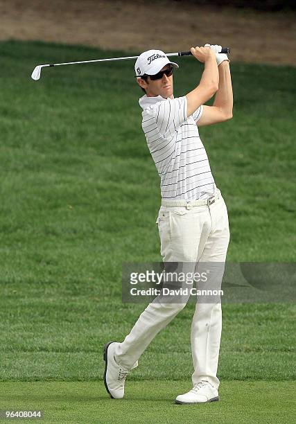 Gregory Bourdy of France plays his second shot to the par 4, 14th hole during the first round of the 2010 Omega Dubai Desert Classic on the Majilis...