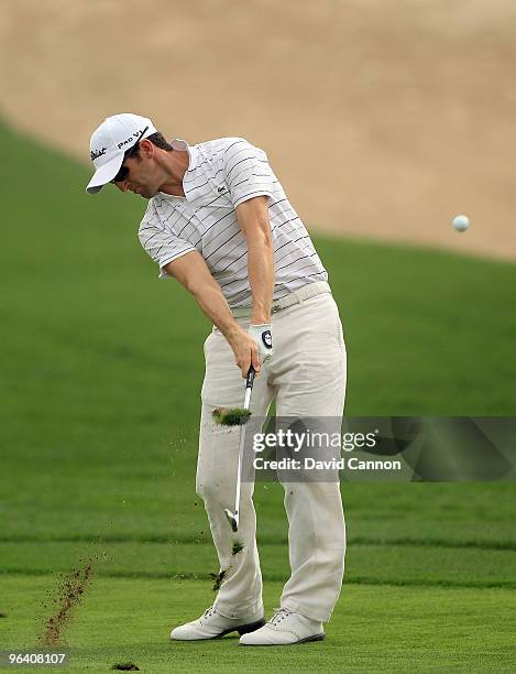 Gregory Bourdy of France plays his second shot to the par 4, 9th hole during the first round of the 2010 Omega Dubai Desert Classic on the Majilis...
