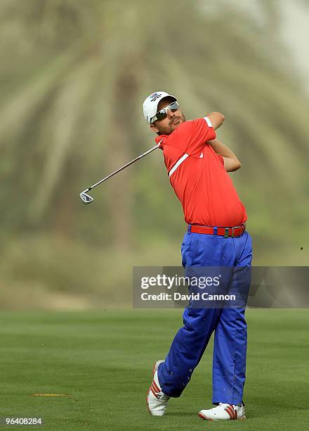 Felipe Aguilar of Chile plays his second shot to the par 4, 14th hole during the first round of the 2010 Omega Dubai Desert Classic on the Majilis...