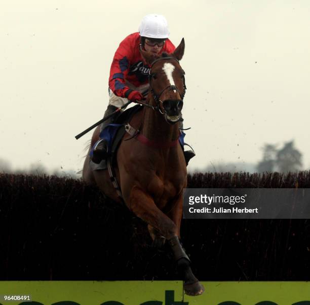 Sam Thomas and Green Belt Elite clear the last fence before wining The Andrew Hopkins Concrete Novices' Handicap Steeple Chase Race run at Wincanton...