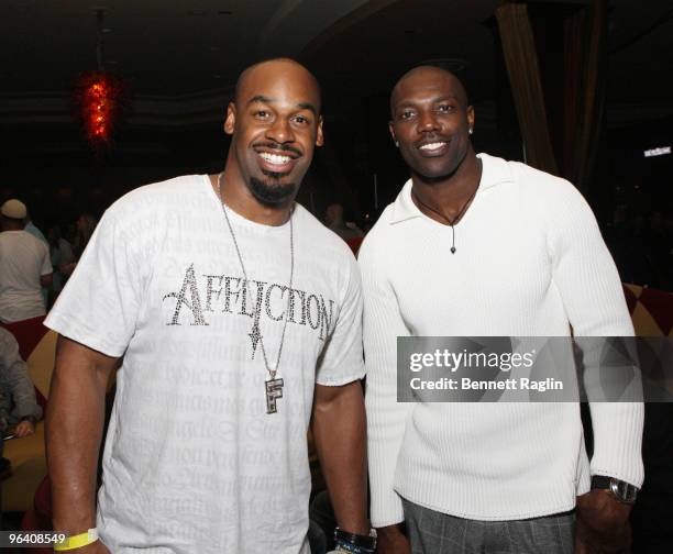 Donavan McNabb of the Philadelphia Eagles and Terrell Owens of the Buffalo Bills attend the Moves Magazine Annual Super Bowl Gala on February 3, 2010...