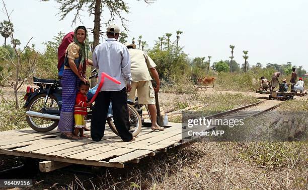 Residents ride on Norries or Lorries at Tbeng Khpos train station in Kompong Chhnang province some 50 kilometers north-west of Phnom Penh, 12 March...