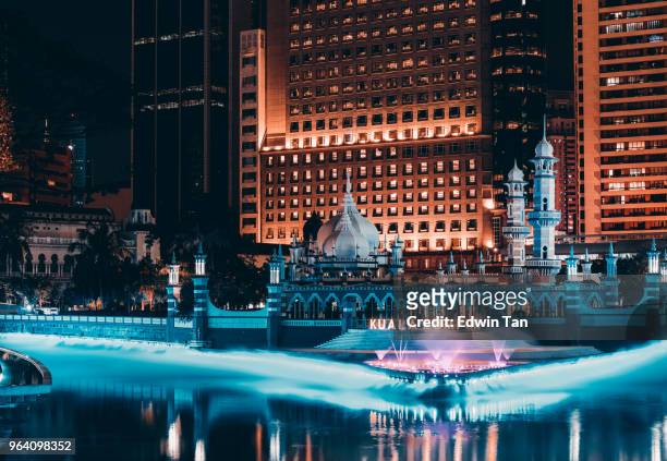 jamek mosque in the heart of kuala lumpur in malaysia at night in front of river of life - newly industrialized country imagens e fotografias de stock