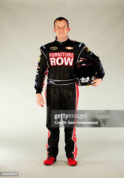 Regan Smith, driver of the Furniture Row Chevrolet, poses during NASCAR media day at Daytona International Speedway on February 4, 2010 in Daytona...