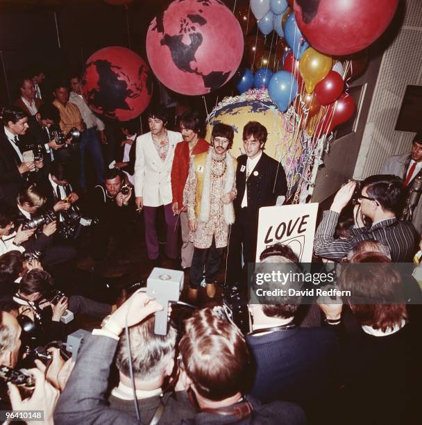 From left, Paul McCartney, George Harrison, Ringo Starr and John Lennon of English rock and pop group The Beatles pose together during a press call...