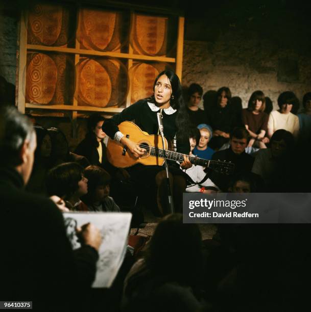 Joan Baez performs on a TV show in London c.1965. Image is part of David Redfern Premium Collection.