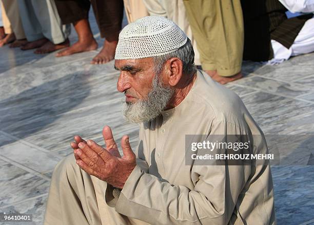 Pakistani Muslim prays inside the Data Darbar, which holds the shrine of Saint Syed Ali bin Osman Al-Hajvery, popularly known as Data Ganj Bakhsh,...