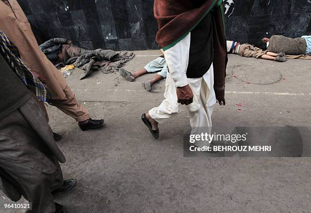 Displaced Pakistanis sleep outside the Data Darbar, which holds the shrine of Saint Syed Ali bin Osman Al-Hajvery, popularly known as Data Ganj...